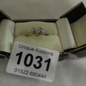 An 18ct gold ring set 3 diamonds, size N