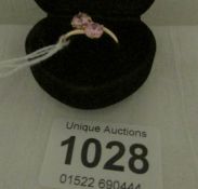 A 14ct gold ring set 2 pink stones, size Q