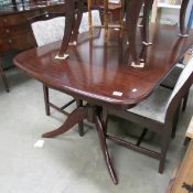 A mahogany table and 4 chairs