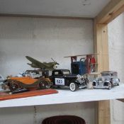 3 model cars and 3 model aeroplanes