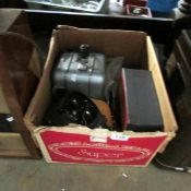 A box of vintage phographic equipment