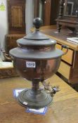 A Victorian copper samovar with brass tap