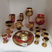 A Quantity of red glass with gilt decoration including goblets, vases etc