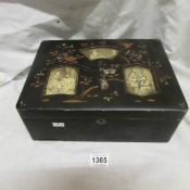 An oriental 3 picture lacquered box