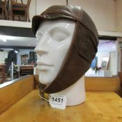An early leather cycling/motorcycle helmet (head not included)