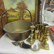 A brass jam pan, candlesticks, shell cases etc