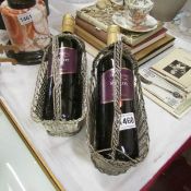 2 silver plated wine bottle holders with wine