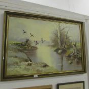 A framed ducks over lake scene signed Gailey