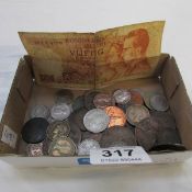 A mixed lot of coins including some pre 1947 silver