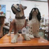 A boxer dog and a spaniel figures