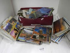 A box of assorted postcards