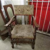 A 19th century oak carver chair with carved front stretcher