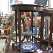 A mahogany circular occasional table