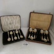 A cased set of silver spoons with sugar nips and a cased set of silver spoons (1 spoon missing)