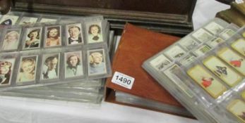 A large collection of cigarette cards and an albun