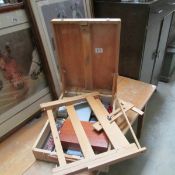 An artist's paint box and easel