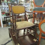 A mahogany inlaid elbow chair