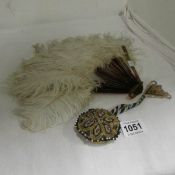 An Ostrich feather fan and an early African beadwork purse