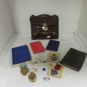 A leather case of Masonic regalia and books including silver