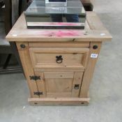 A rustic style bedside cabinet