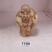 A Chinese bone figure of a man