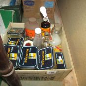 A box of tins and bottles