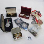 A mixed lot of coins, badges, Civil Defence medal etc