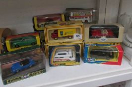 A quantity of boxed Corgi cars including Surf & Heinz vans