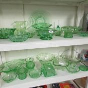 A large quantity of green glass including Deco (2 shelves)