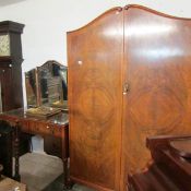 A walnut wardrobe and dressing table