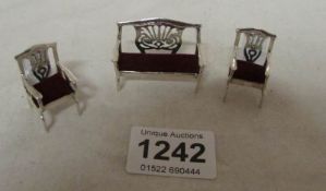 A miniature silver settee and 2 chairs