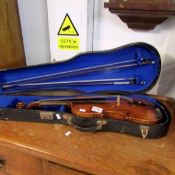 A violin and 2 bows in case