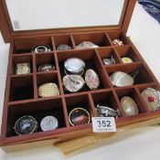 A collection of pill boxes in display case