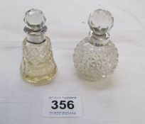 2 cut glass perfume bottles with silver rims