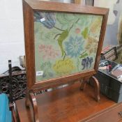 An oak tapestry fire screen