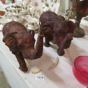 A pair of wooden elephants