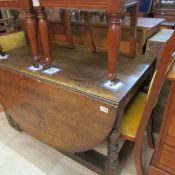 A large period oak drop leaf table