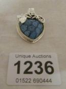 A silver millifiori blue pendant