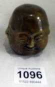 A 4 faced brass Buddha head