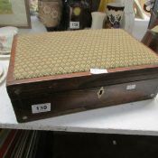 A mahogany writing box with upholstered lid