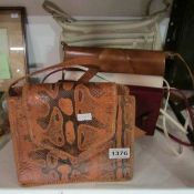 A snakeskin hand bag and 4 others