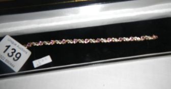 A 9ct gold pink sapphire and diamond bracelet