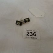 A pair of Masonic silver cuff links