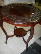 A carved occasional table