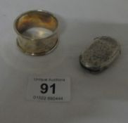 A silver vesta case and napkin ring