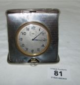 A silver cased travel clock, HM Birmingham 1912
