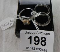 A 14ct 16 stone natural diamond trilogy ring with certificate