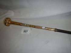 A gold plate and mother of pearl swordstick