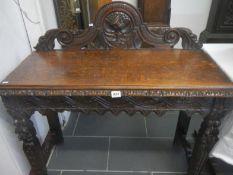 A carved oak hall table a/f