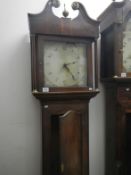 An oak cased long case clock with plain face